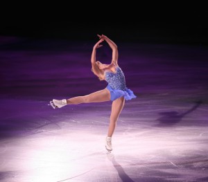 Professional woman figure skater performing at Stars on ice show