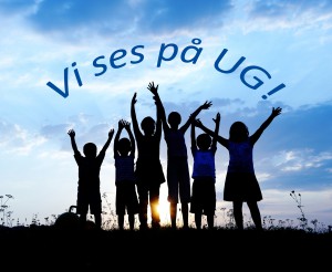 group of happy children playing on meadow, blue sky, summertime